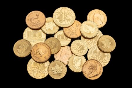 Stacked gold bars representing precious metal investment amid dollar weakness