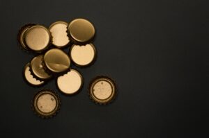 Stacked gold bars reflecting light against a dark background