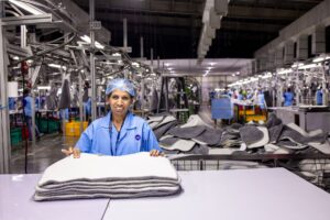 Workers on an automotive assembly line at a Volkswagen production facility