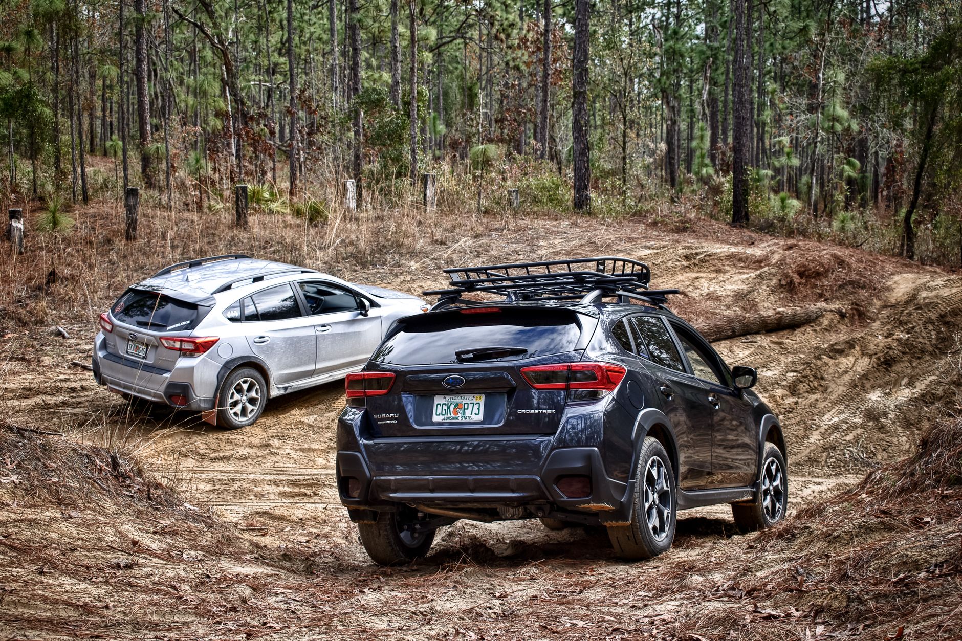 A modern SUV driving on a rugged off-road trail
