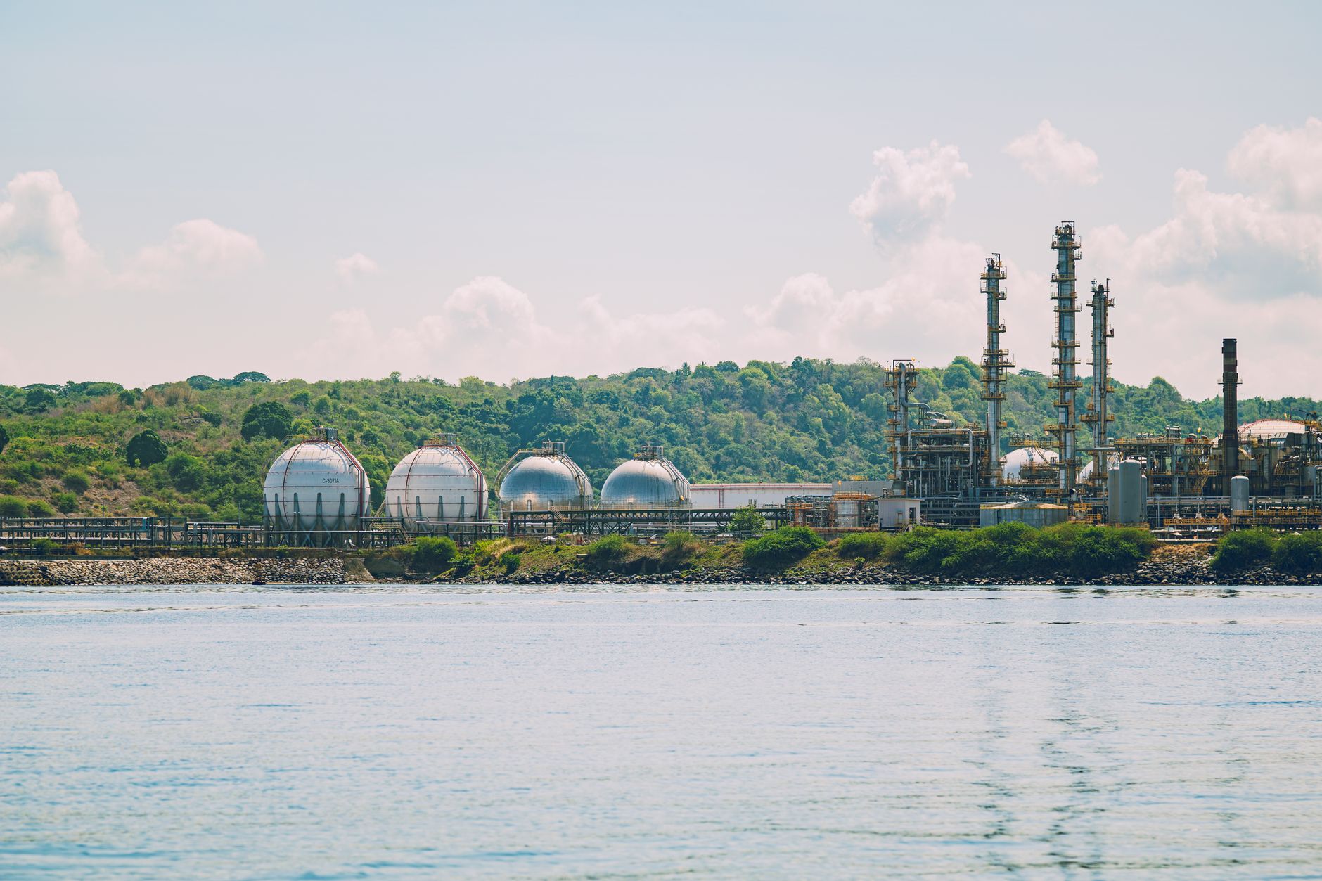 Large industrial tanks at a chemical processing facility