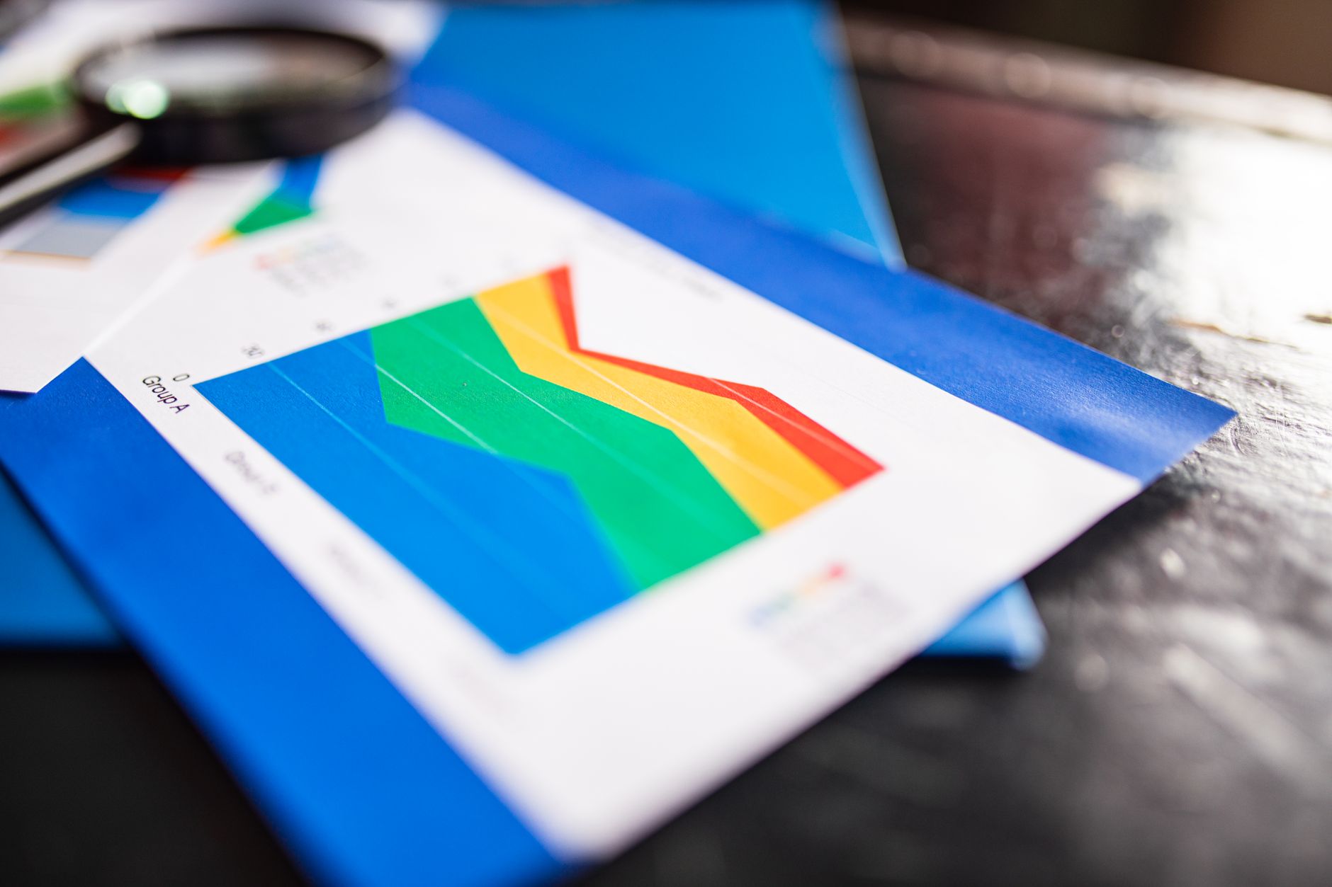 Federal economic data documents spread on a desk representing labor statistics revision