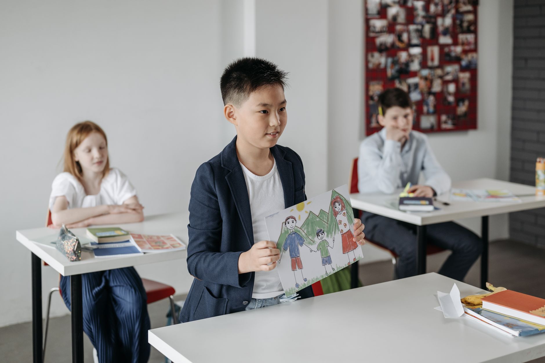 Elementary school children seated in a classroom at the start of the school year