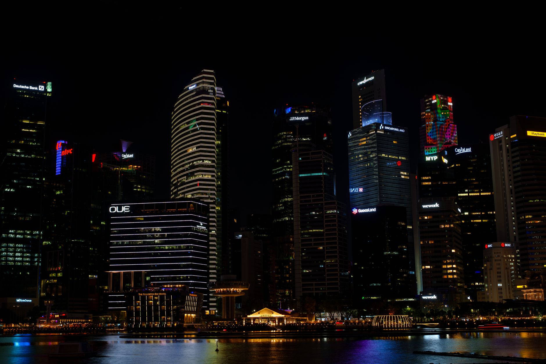 Asian city financial district with office buildings and market signage