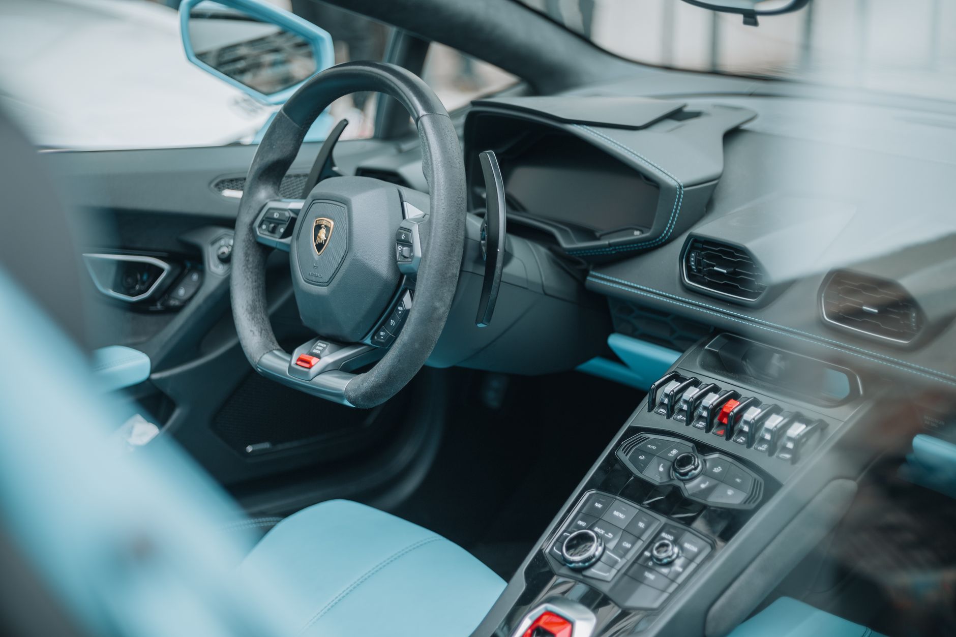 A sleek luxury sports car on display at an automotive event