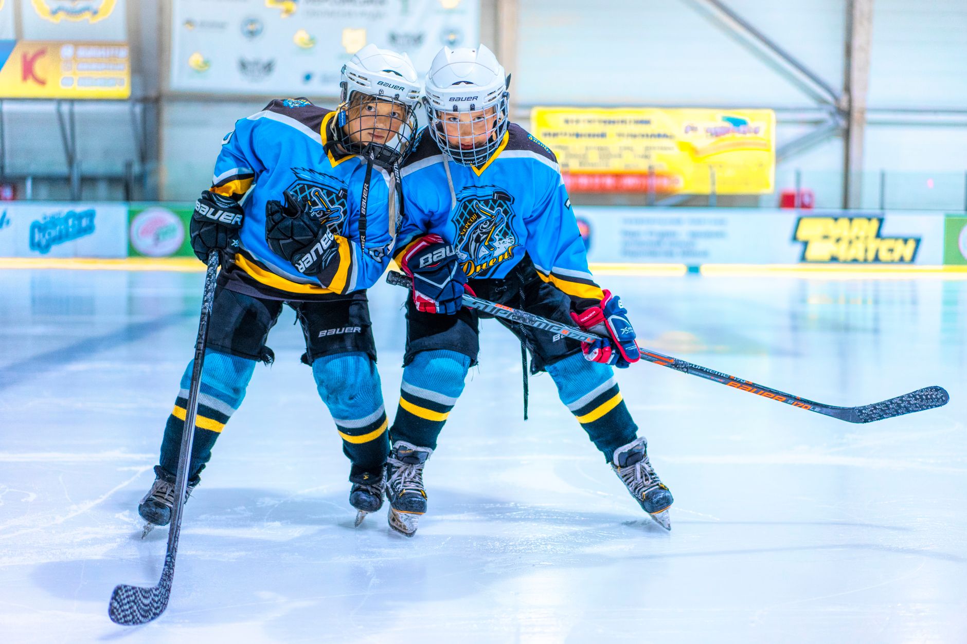 Female hockey players celebrating on ice after a championship win