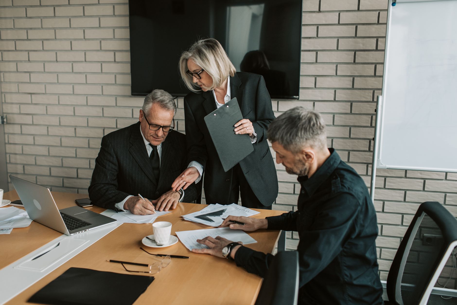 Business executives in a boardroom discussion during a corporate meeting