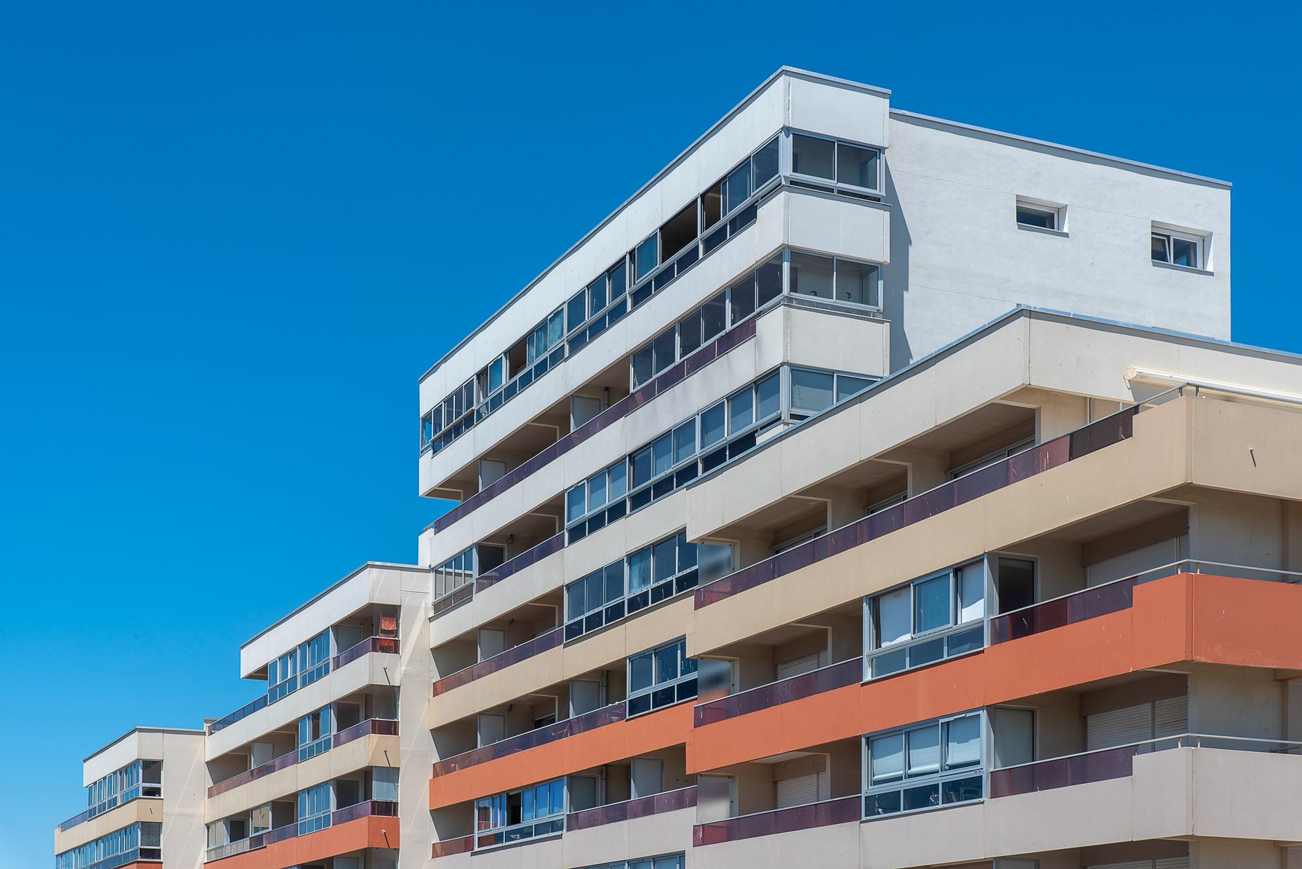 Urban residential apartment complex in a coastal high-barrier real estate market