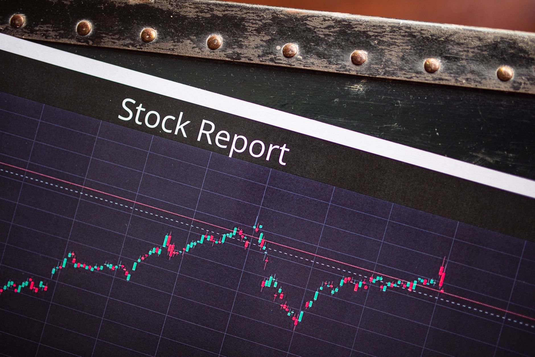 Trader watching financial screens showing bond and equity market movements