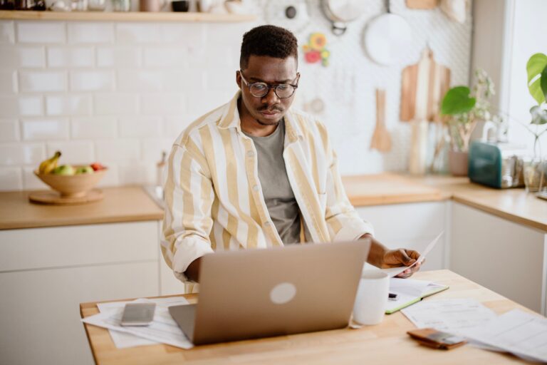 $2 Million Saved for Retirement Sounds Like Enough. It Might Not Be. Stack of cash and retirement account statement on a desk