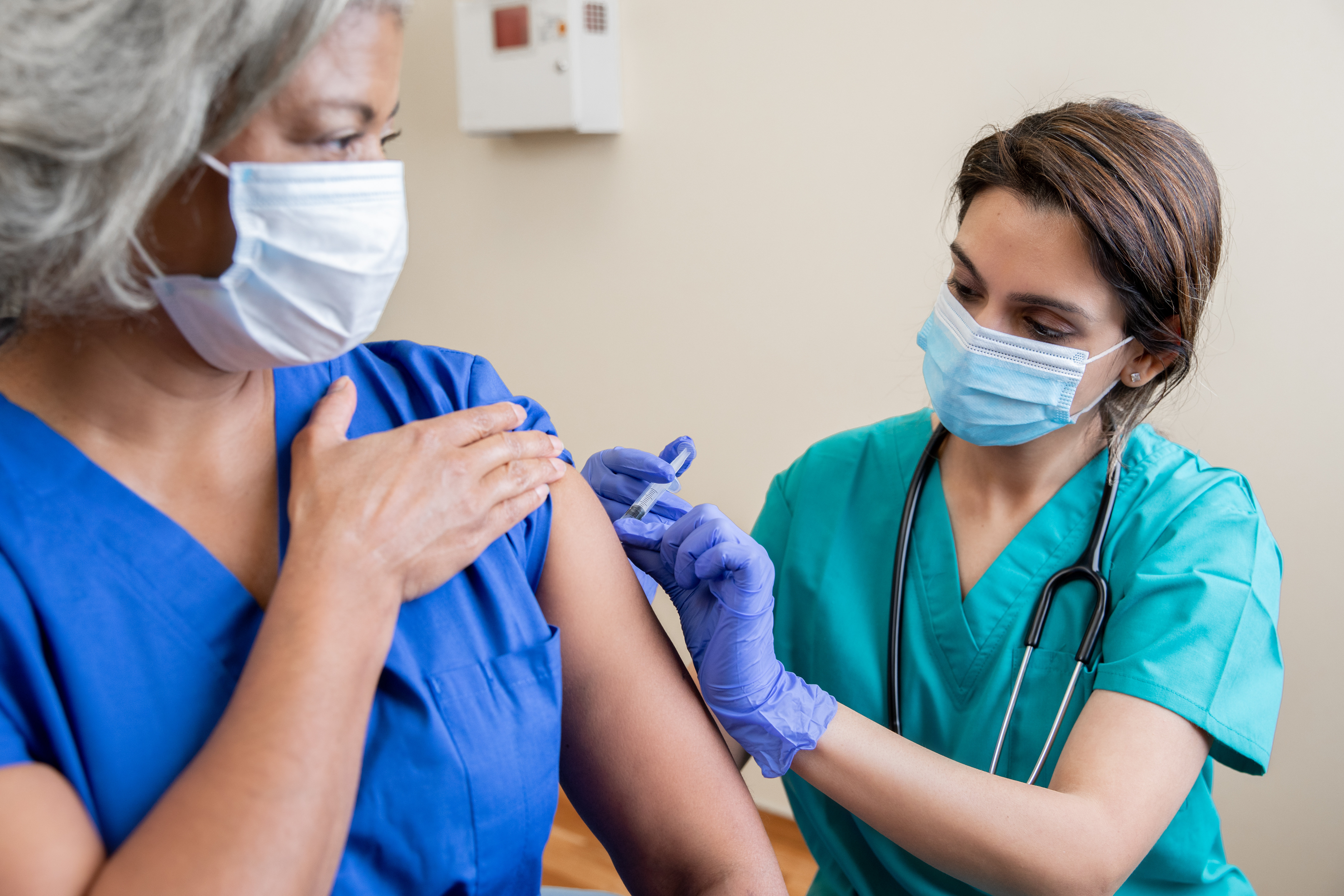 Medical professional reviewing cancer treatment options with patient