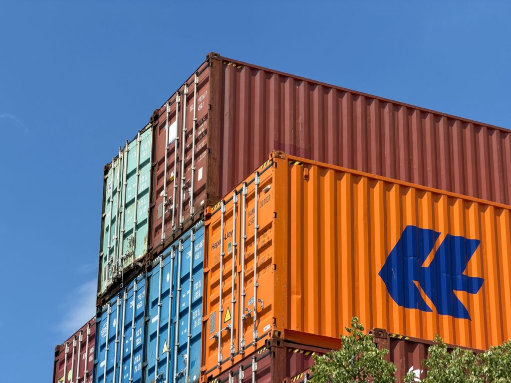 Large cargo shipping containers at a port representing global trade flows
