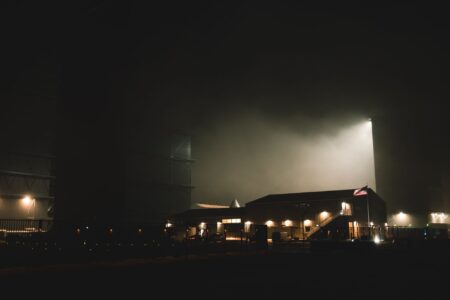Rocket launching into night sky representing SpaceX commercial ambitions
