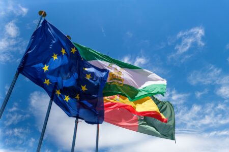 Trump Warns EU Over Canada Membership Talks, Threatens New Tariffs International flags representing diplomatic relations between major economies