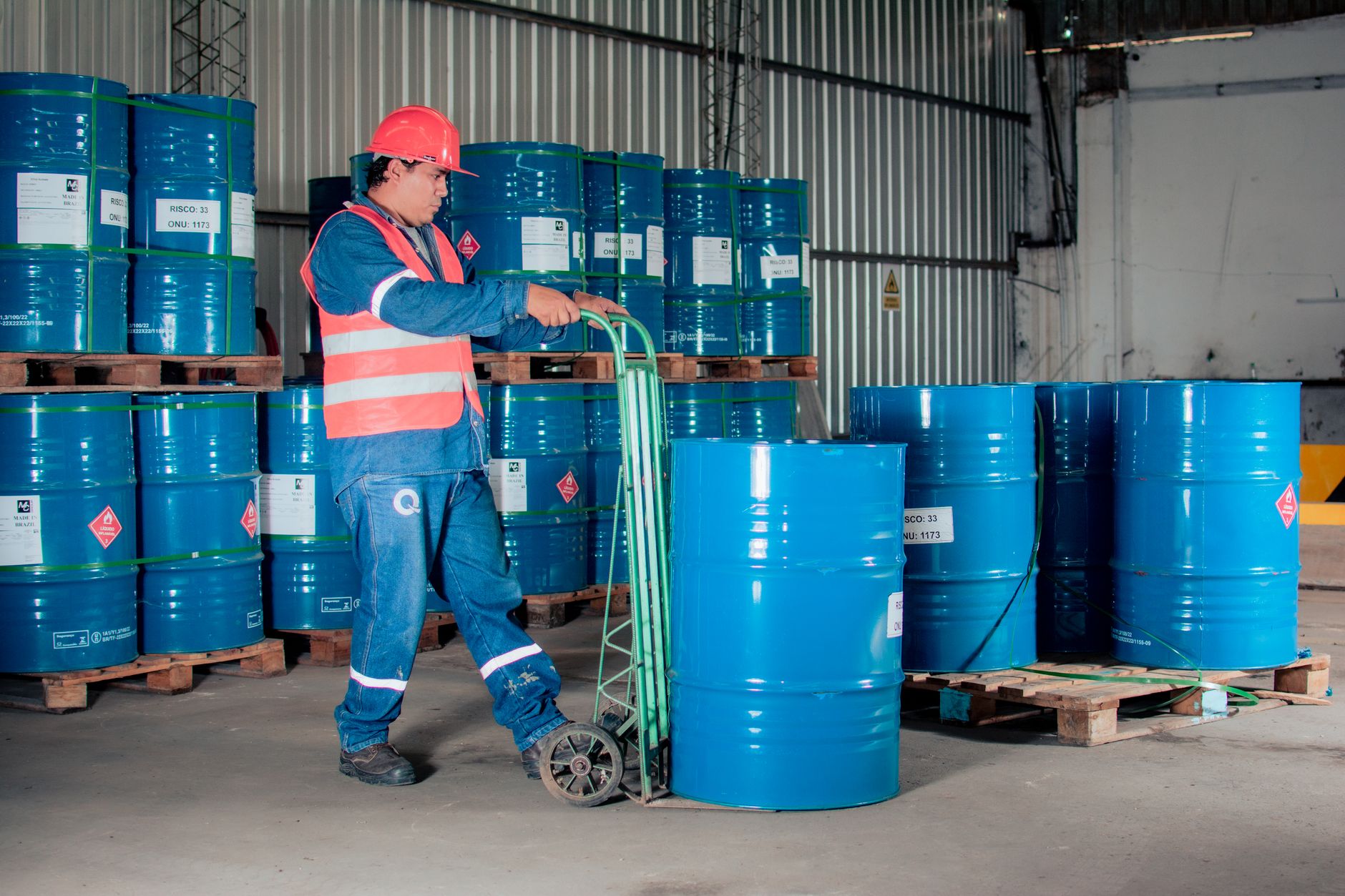 Rows of oil storage barrels at an industrial facility