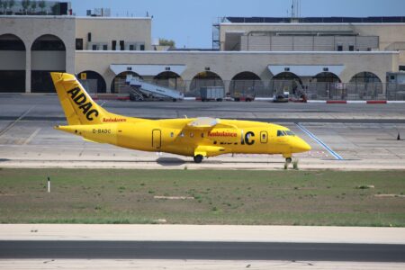 Emergency vehicles responding on an airport runway after an incident