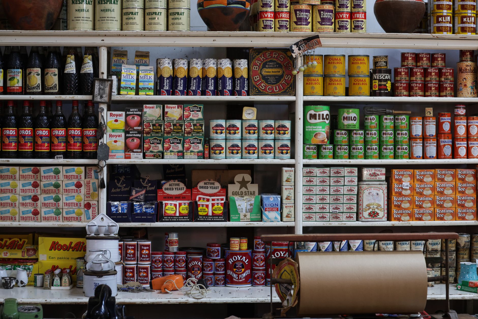 Store brand and national brand products side by side on a supermarket shelf