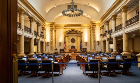 Two debate podiums on a stage representing a Senate candidate debate