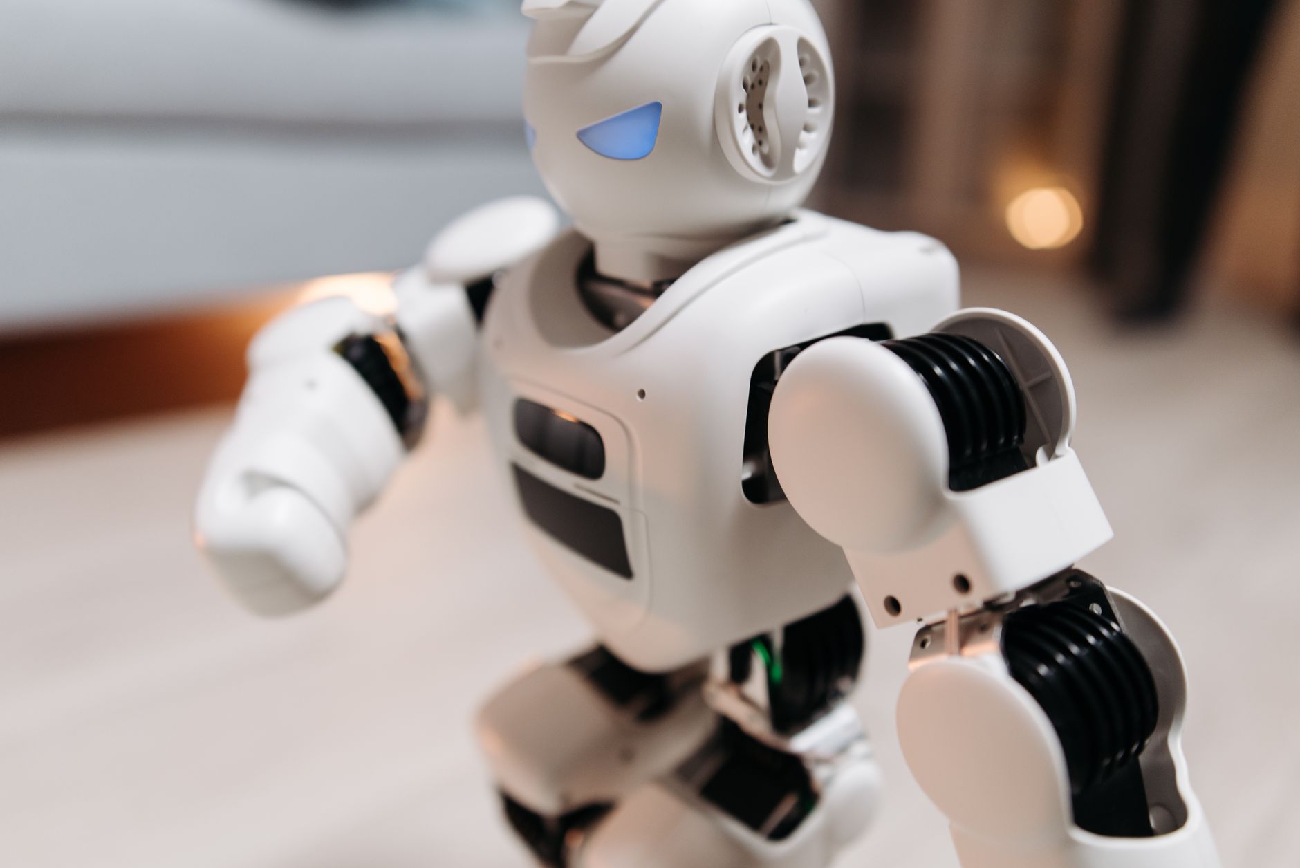 A humanoid robot standing in an industrial manufacturing environment