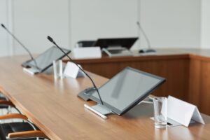Corporate boardroom representing a major media acquisition deal
