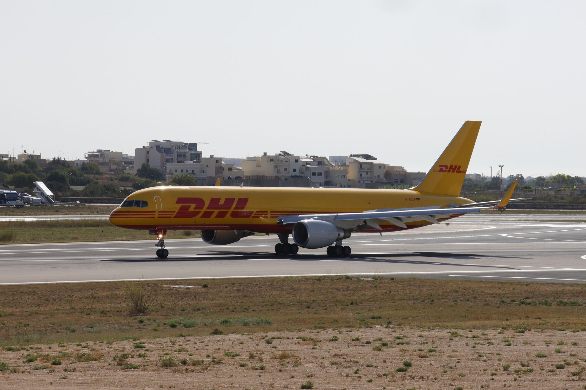 Passenger jets lined up on an airport tarmac awaiting handover