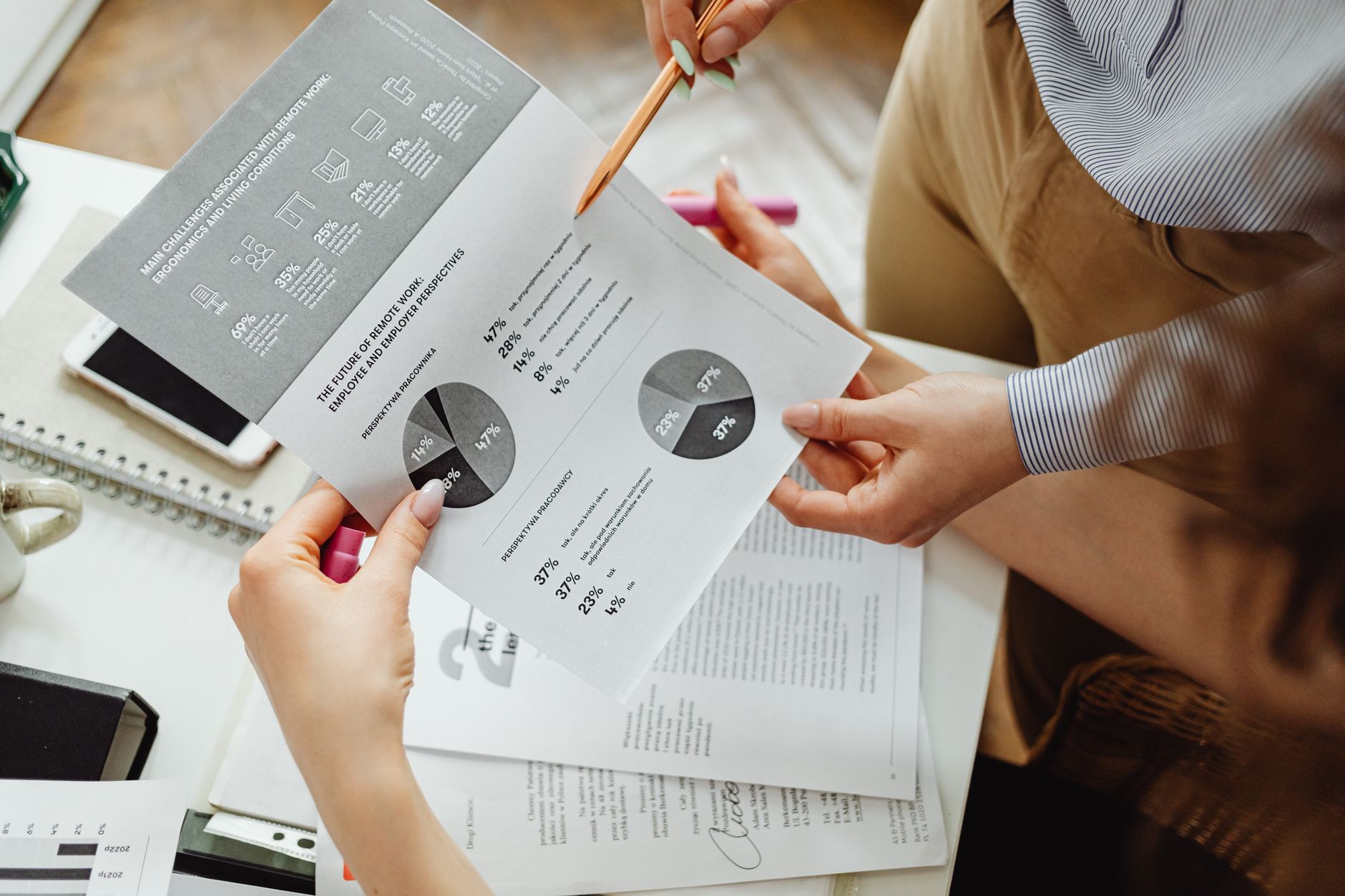 Business professional reviewing quarterly earnings report documents