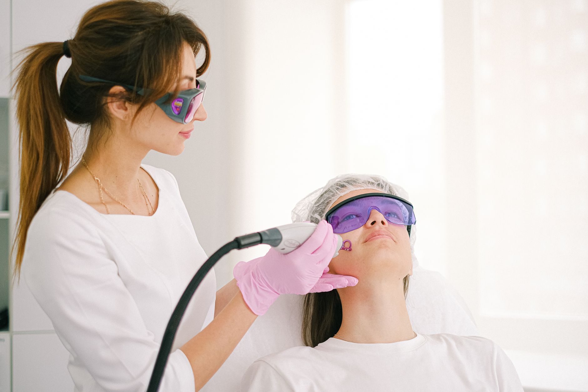 A patient undergoing a non-surgical cosmetic treatment in a modern clinic setting
