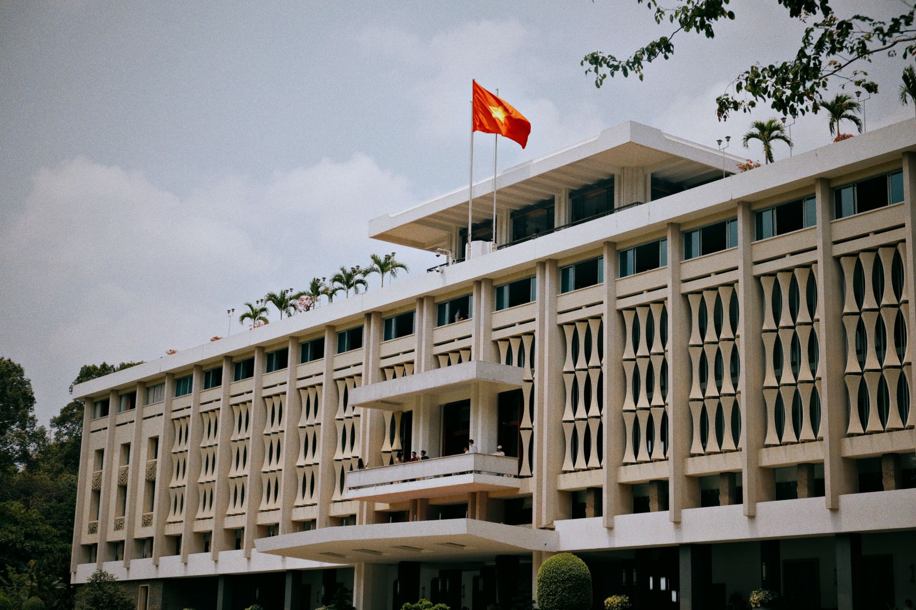 Exterior of a government embassy building with security barriers