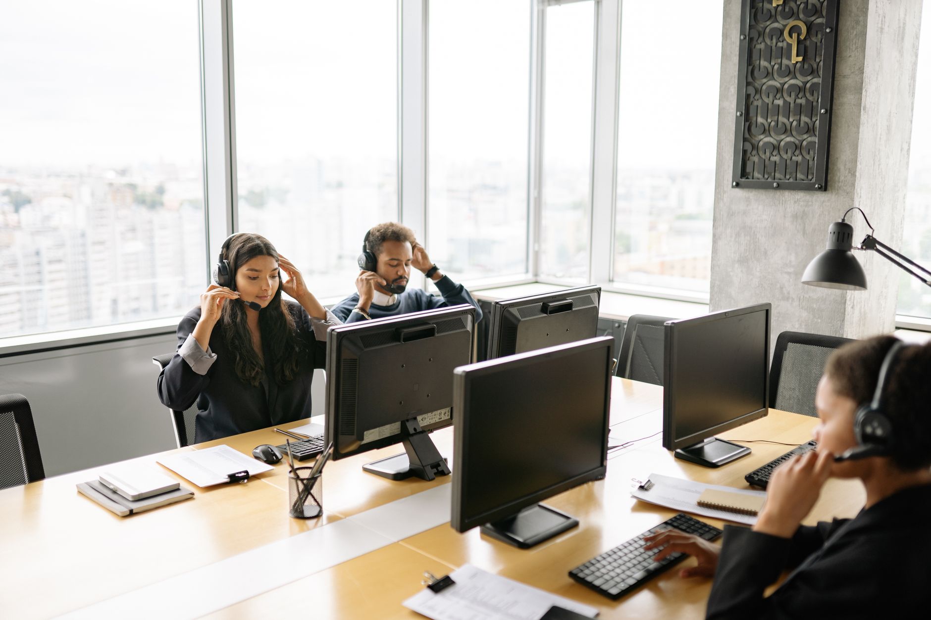 Consultants working in a professional services firm discussing project pipeline