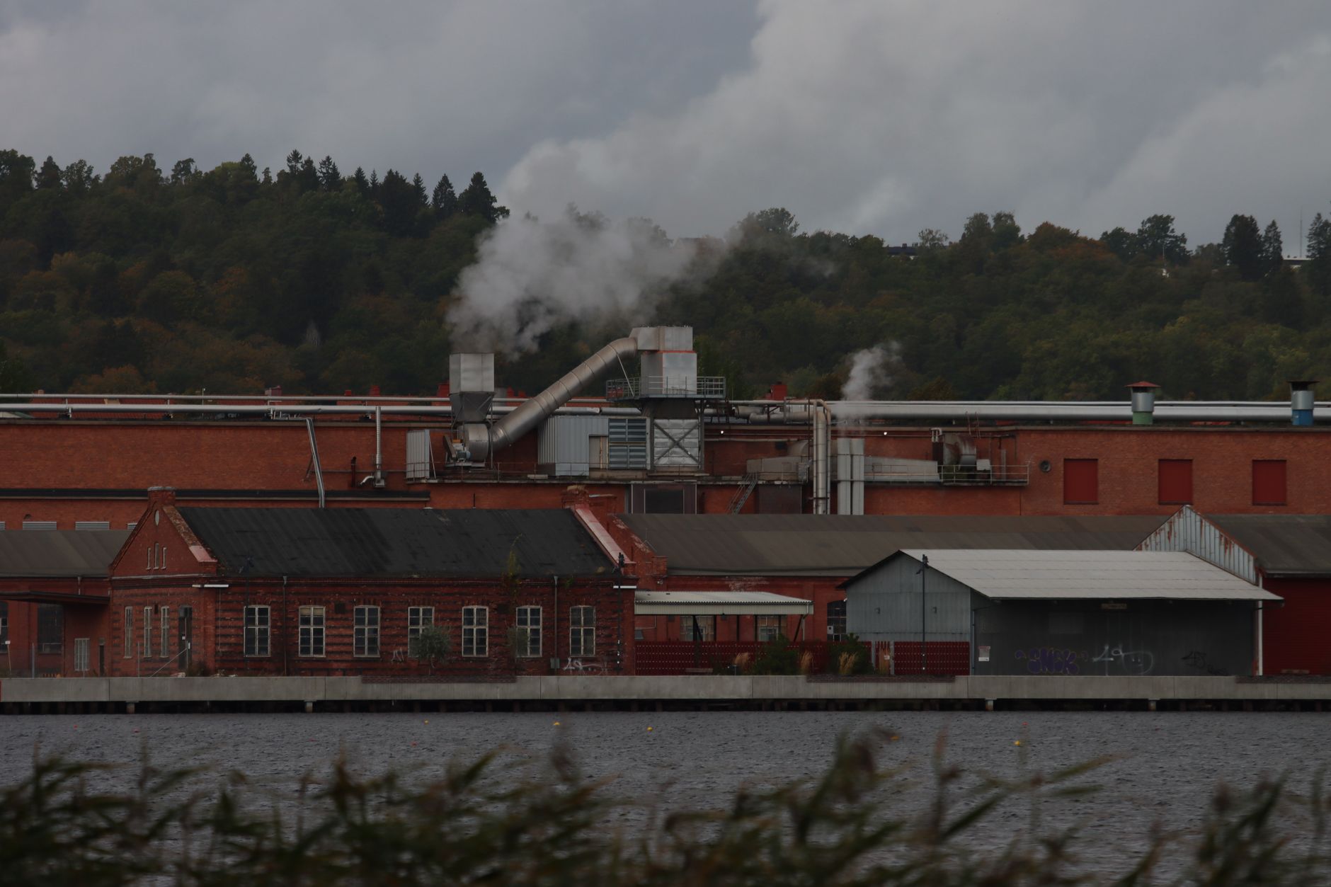 Smoke rising from an industrial building during an emergency response