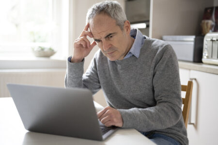Investor watching stock market data on trading screen during market decline