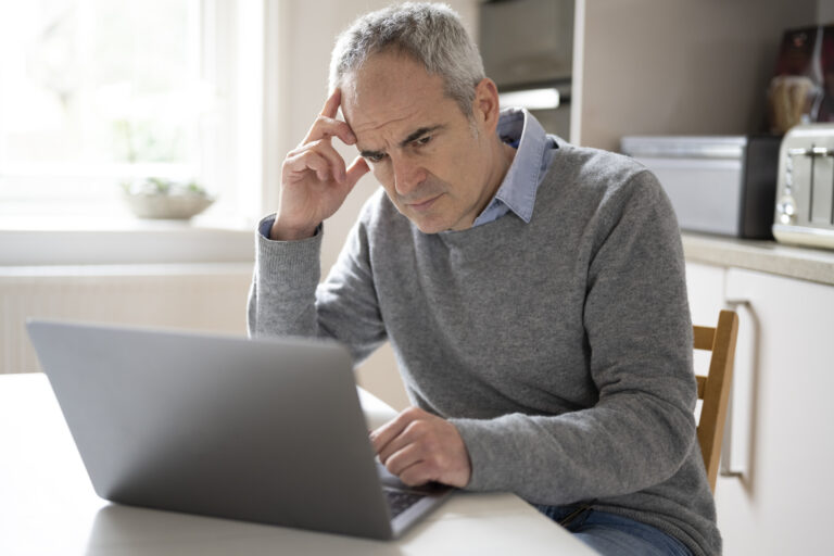 Investor watching stock market data on trading screen during market decline