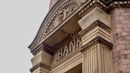 Banco Bradesco Wealth Chief Buys $1.1M Preference Shares: Is It a Buy? Executive reviewing financial documents at a large bank office desk