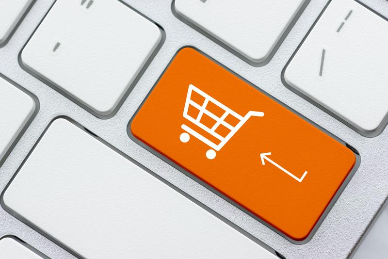 Person using mobile payment app in a Latin American market setting